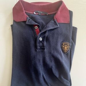 Brand: Gucci. Color:dark blue. A polo shirt for men